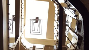 A modern interior with a curved glass staircase leading to a lower level. - Hotel VDN by Good Rade (Dakar)