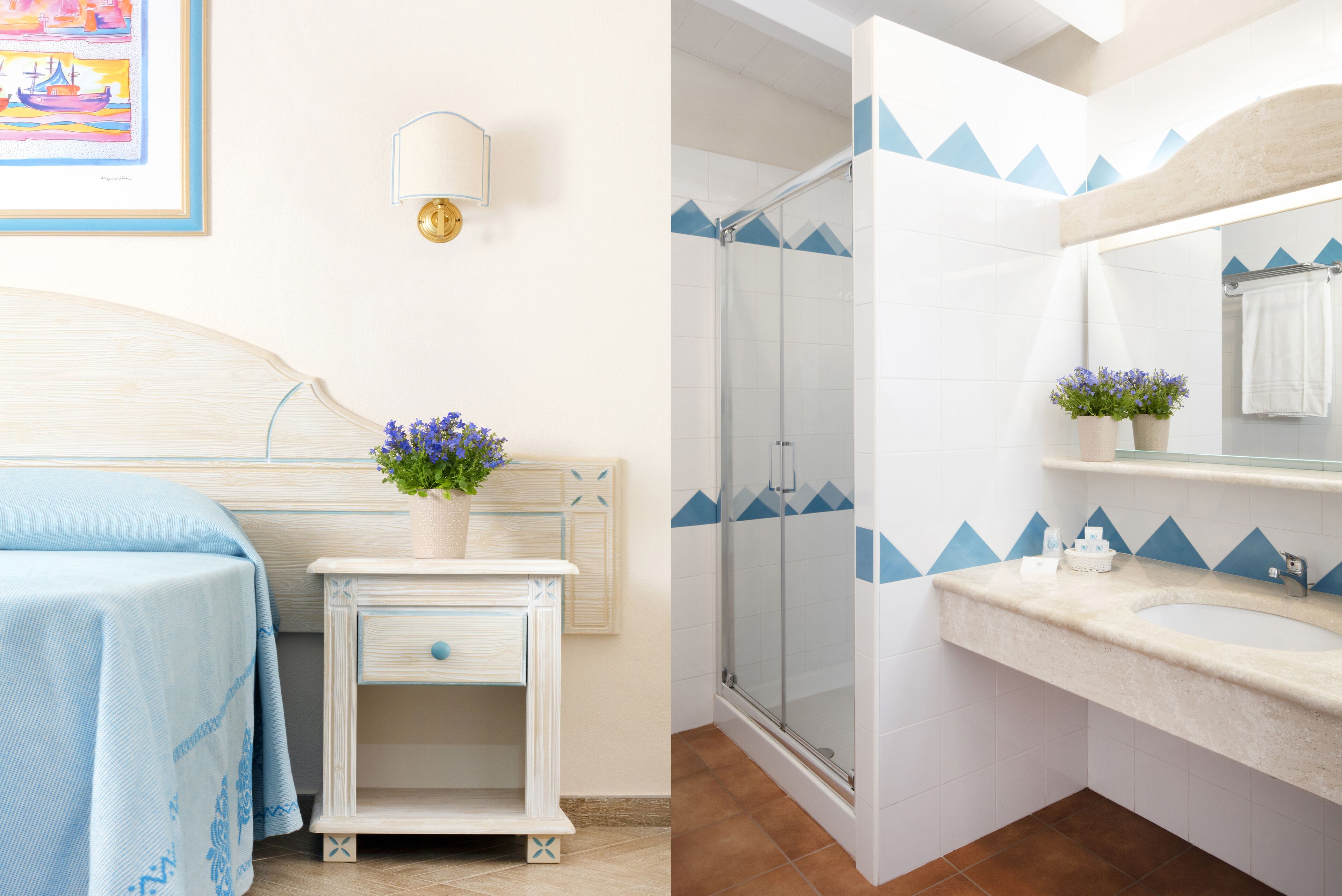A hotel room with a bed, bedside table, and a small cabinet. There is a shower area with a glass door and a sink with a mirror above it.