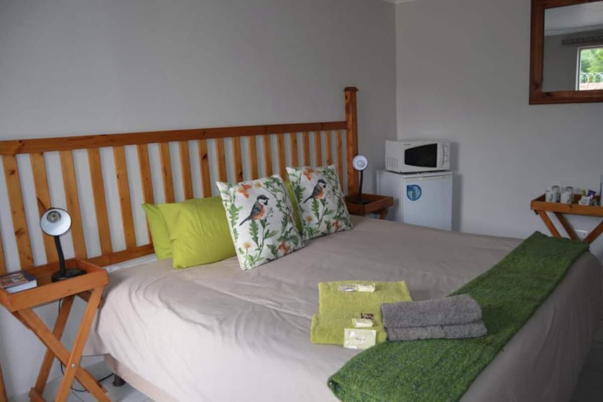 Desk, laptop workspace, blackout curtains, iron/ironing board