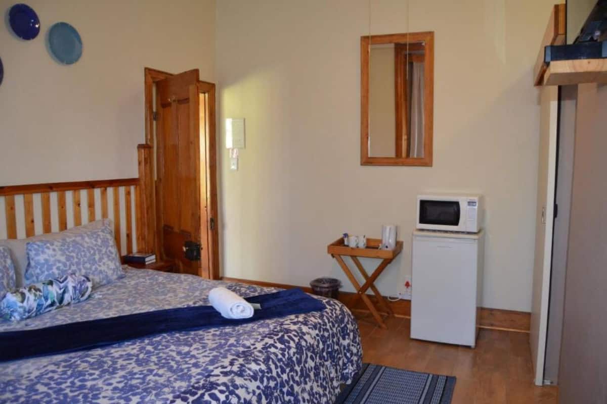 Desk, laptop workspace, blackout curtains, iron/ironing board