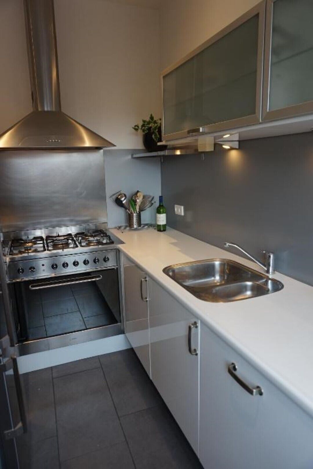 Fridge, dishwasher, coffee/tea maker, cookware/dishes/utensils