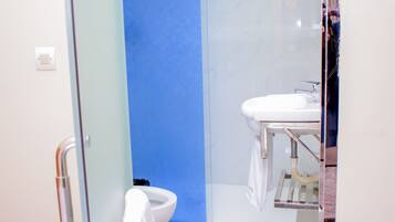 Basic Single Room | Bathroom | Shower, rainfall showerhead, soap, toilet paper