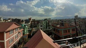 A cityscape with buildings under a clear sky. - A Dutch Nepali home with a beautiful view (kathmandu)