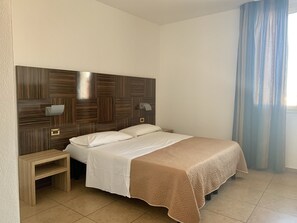 Double or Twin Room | Desk, laptop workspace, blackout drapes, free WiFi