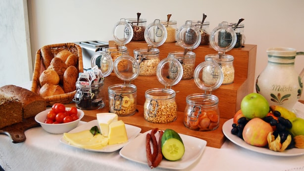 A breakfast buffet with various food items and condiments. - Hotel & Restaurant Klosterhof (Gutenzell)