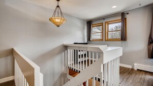A staircase with white railings leading to a landing. - PET FRIENDLY Condo close to Main Street in Frisco!! (Frisco)