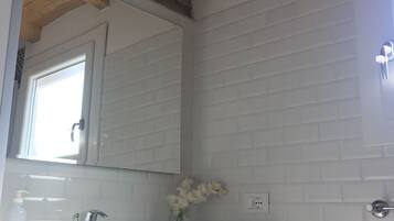 Shower, hair dryer, towels, toilet paper