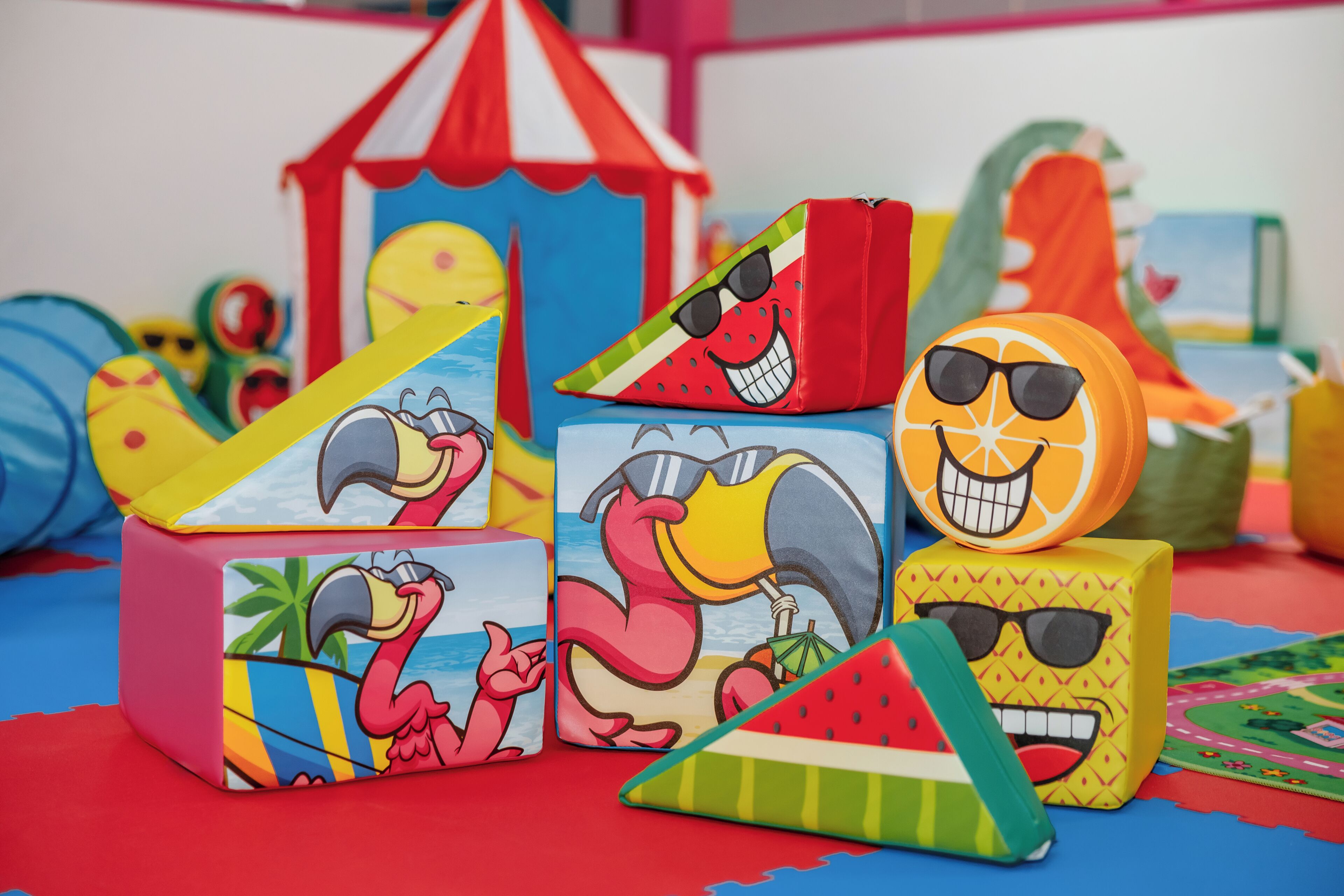 Colorful blocks with animal faces and a watermelon slice.