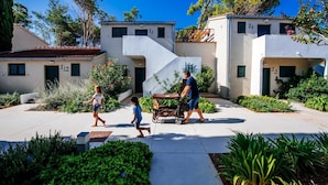 A residential area with modern houses, a clear sky, and a person pushing a stroller. - 3 * apartments / 5pax. (Zaton)