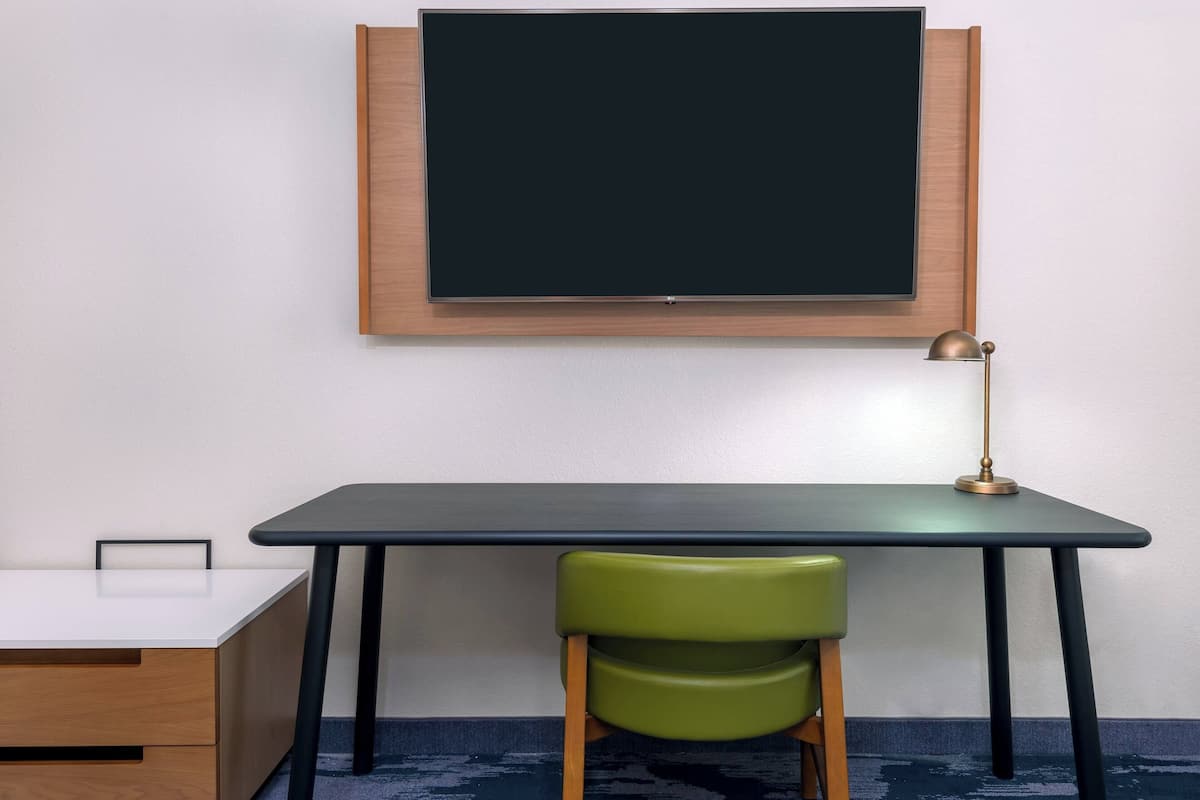 Desk, laptop workspace, blackout drapes, iron/ironing board