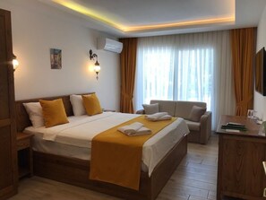 Ropa de cama de alta calidad, minibar, caja fuerte