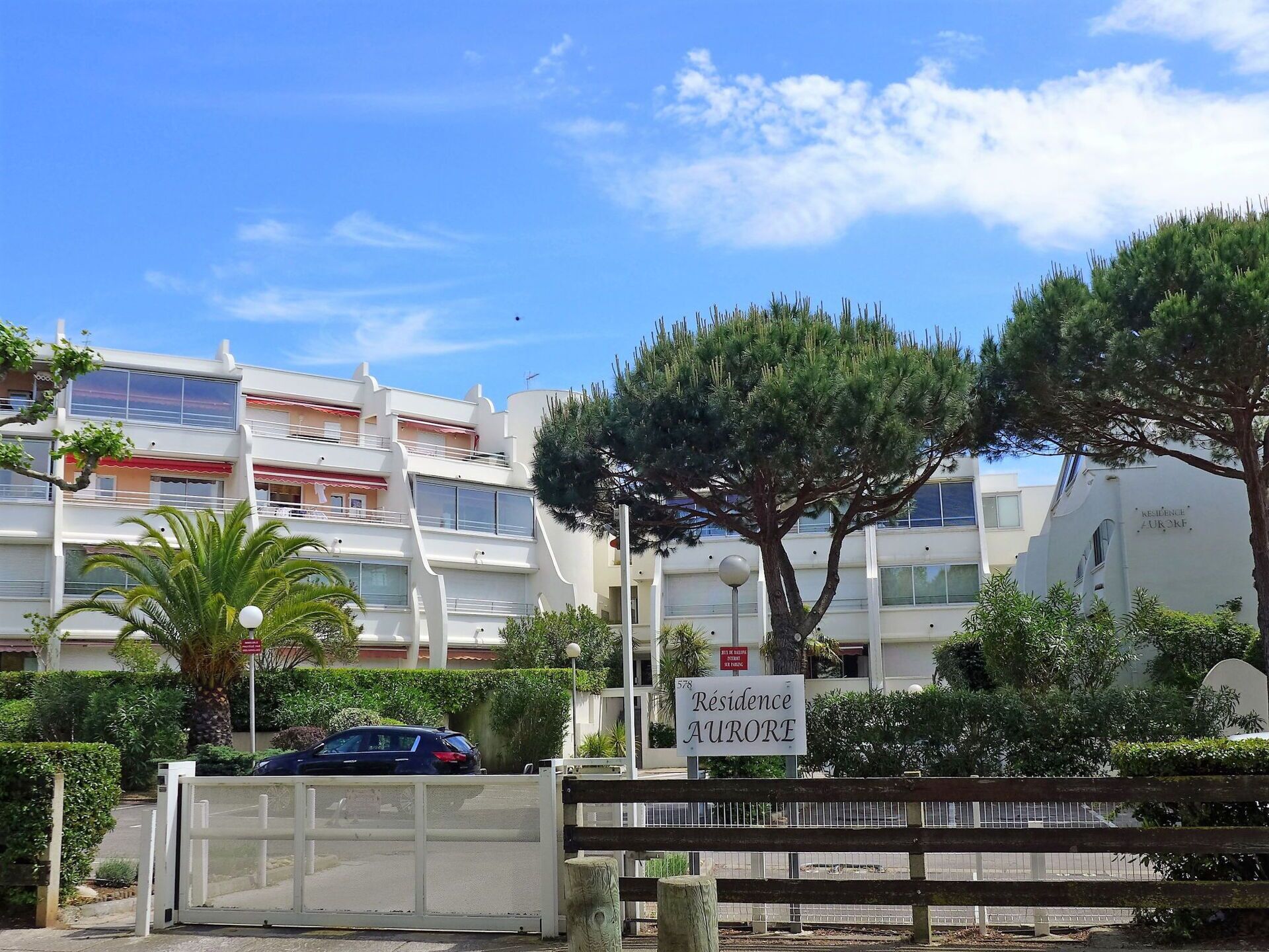 A residential building with a sign indicating 'Résidence Aurore.'