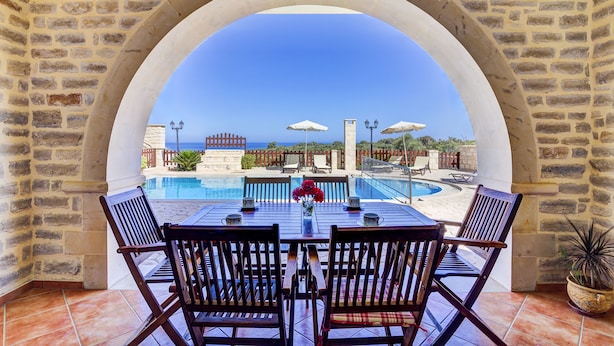 An outdoor seating area with a view of a pool and the sea. - Impressive four bedroom stone house with swimming pool (Rethimno)