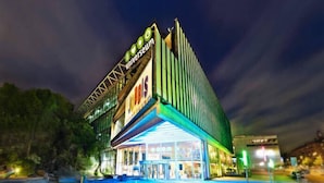 A modern building with a prominent sign reading "Universeum."