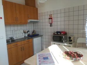 Fridge, microwave, stovetop, coffee/tea maker