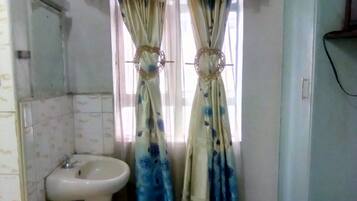 Shower, rainfall showerhead, towels, soap