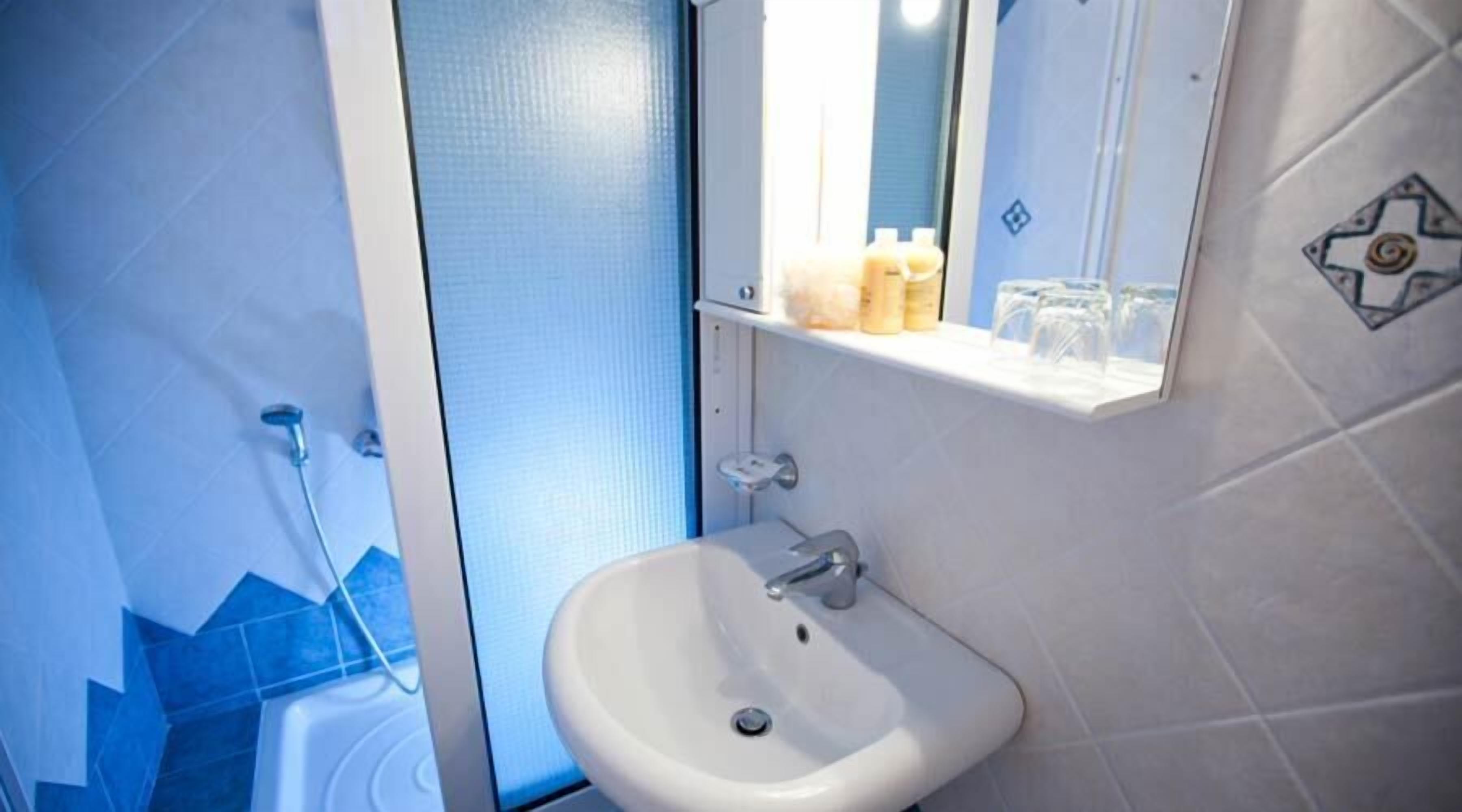 Shower, free toiletries, hair dryer, slippers