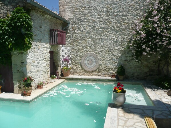 Seasonal outdoor pool, pool umbrellas, pool loungers