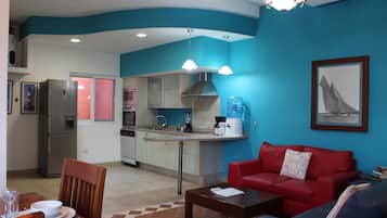 Departamento Confort | Sala de estar | Televisión de pantalla plana