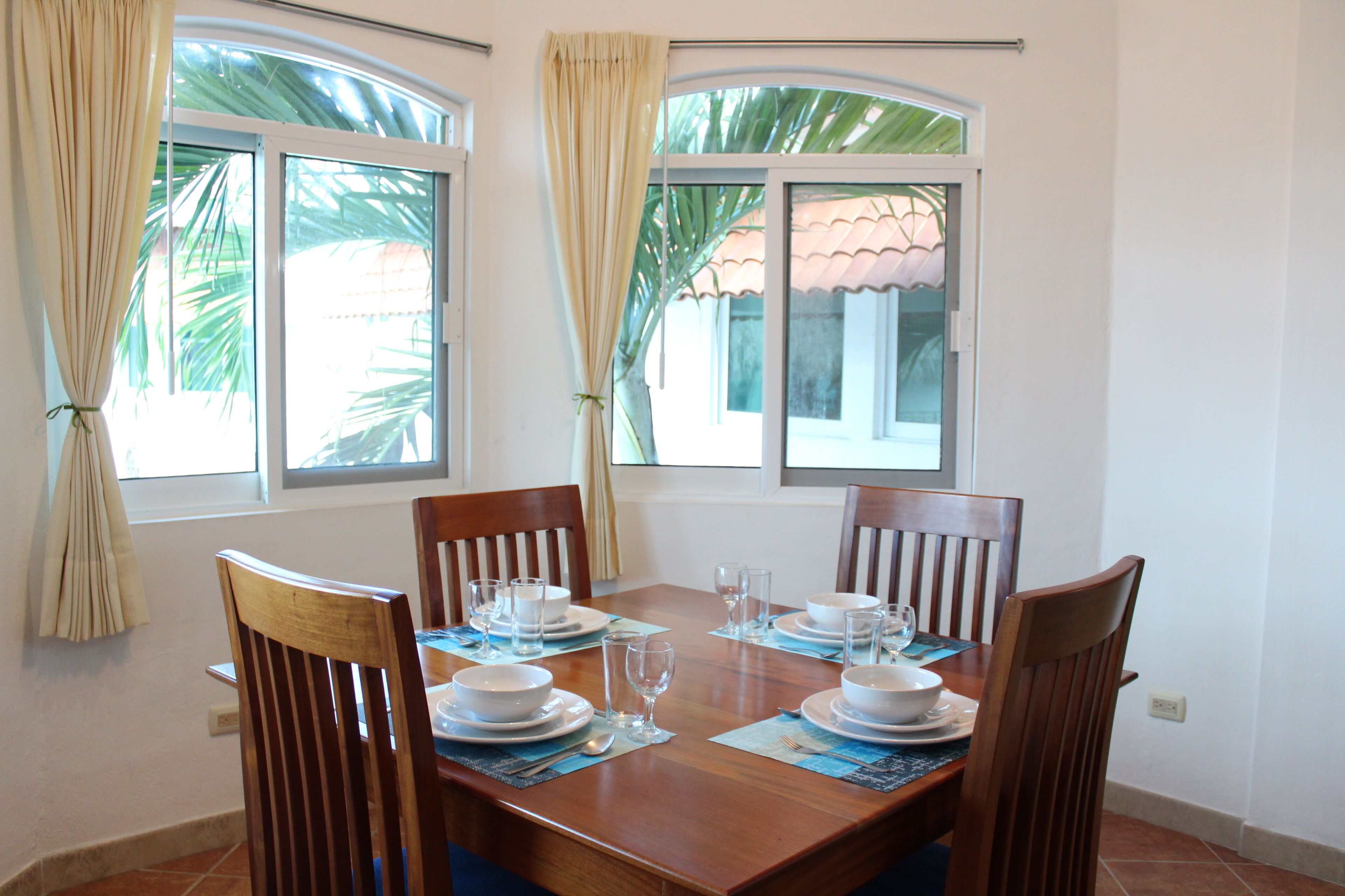 Departamento Confort | Área de sala de estar | Televisión de pantalla plana 