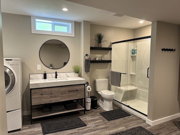 Shower, hair dryer, towels, soap