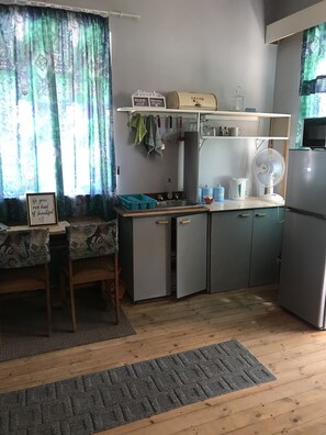 Comfort Apartment (Geophil) | Private kitchen | Fridge, stovetop, cookware/dishes/utensils - Tranquility in Klein Karoo (Oudtshoorn)