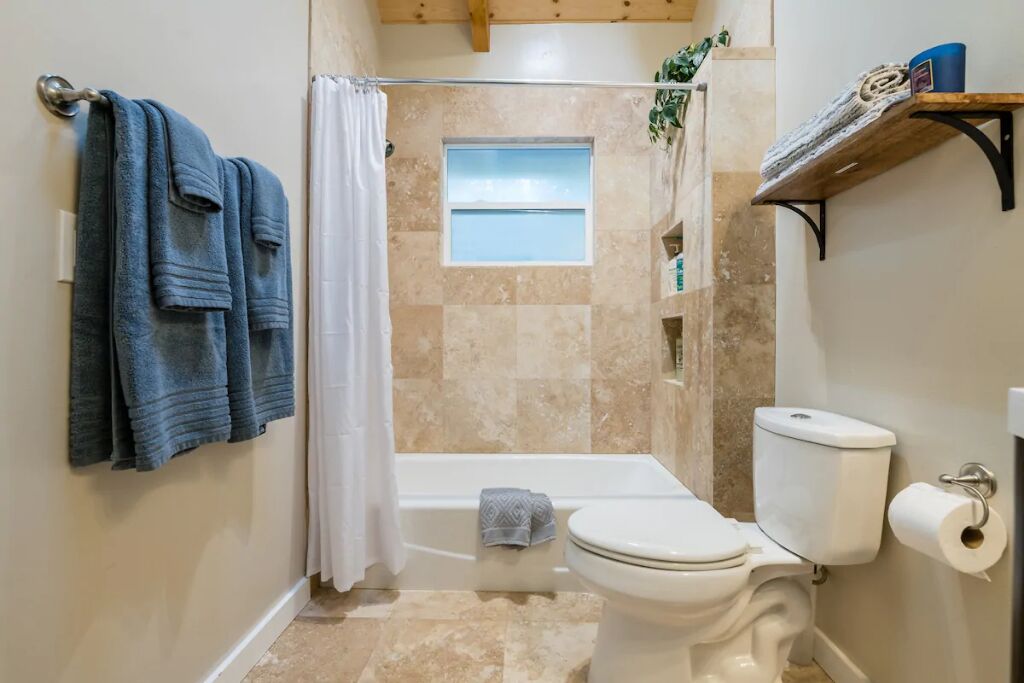 Combined shower/tub, hair dryer, towels, soap