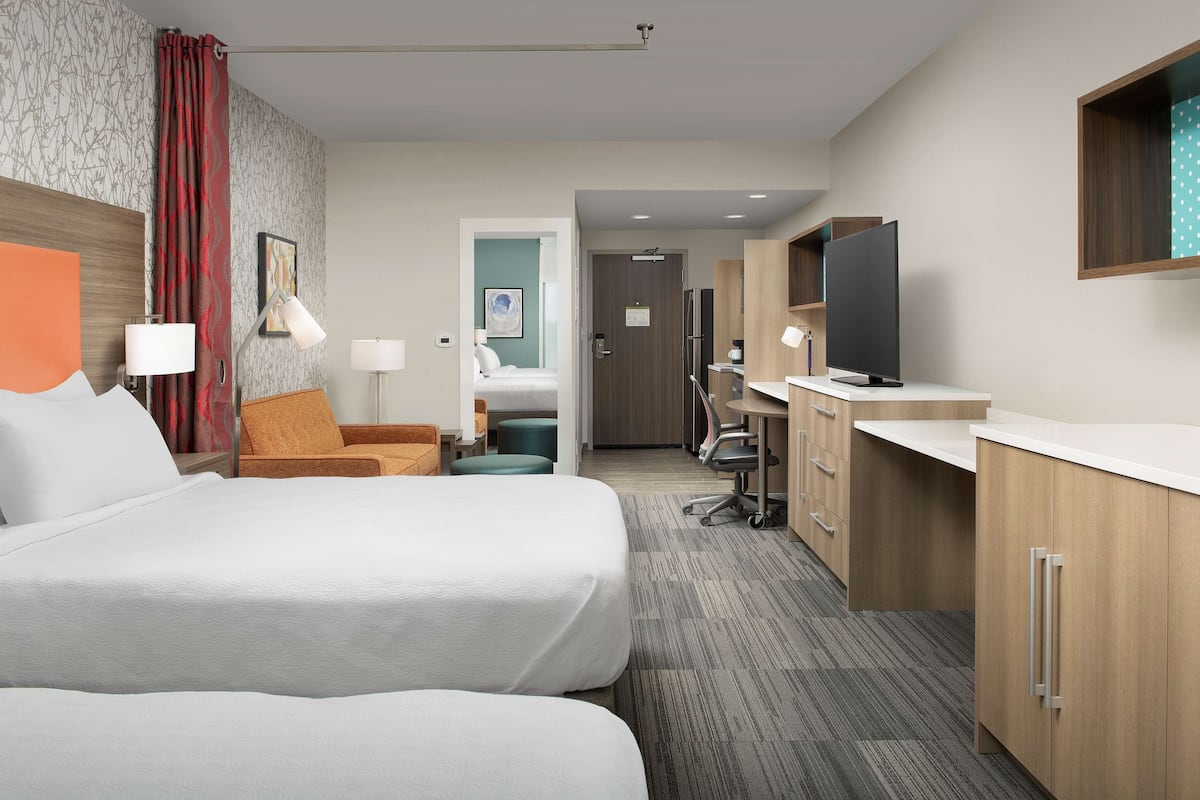 Desk, blackout drapes, iron/ironing board, bed sheets