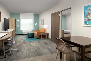 Desk, blackout drapes, iron/ironing board, bed sheets