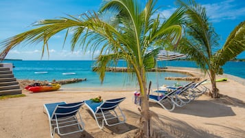 On the beach, sun-loungers, beach towels