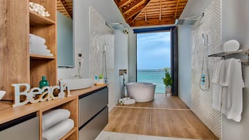 Bathtub, hair dryer, towels, soap