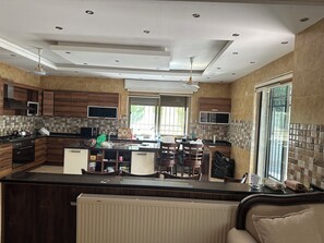 Fridge, oven, cookware/dishes/utensils, dining tables