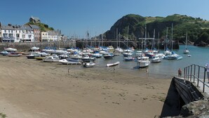 A coastal marina with numerous boats docked, a sandy beach, and buildings in the background. - 3 bedroom accommodation in Cheriton, near Lynton (Cheriton, near Lynton)