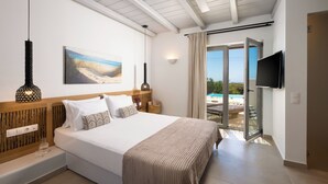 A bedroom with a bed, a television, a painting, and a view of a pool. - Aegean Hospitality Mykonos (Mykonos)