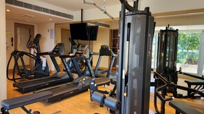 A gym with treadmills, elliptical machines, and weightlifting equipment. - Holiday Inn Express & Suites Bengaluru Old Madras Road by IHG (Bengaluru)