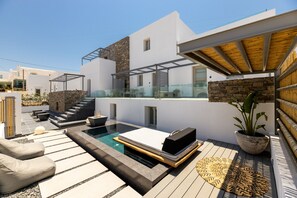 A modern outdoor living area with a pool, lounge chairs, and a pergola. - Parion Opus - Adults Only (Paros)