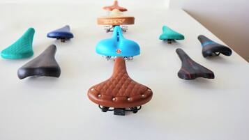 A collection of scooter seats in various colors and designs.