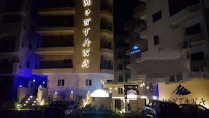 A multi-story hotel with a prominent sign reading "MONTANA" on the facade. - Montana Connection, Hurghada (Hurghada)
