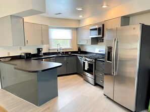 Fridge, microwave, oven, stovetop - Gemini: Canalfront, pool, main house and guest cottage, private dock. (Ocracoke)