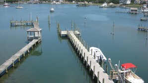 A marina with multiple docks and boats. - Bragg-Tolson House (Formerly Serendipity): Historic Home with Modern Convenience (Ocracoke)