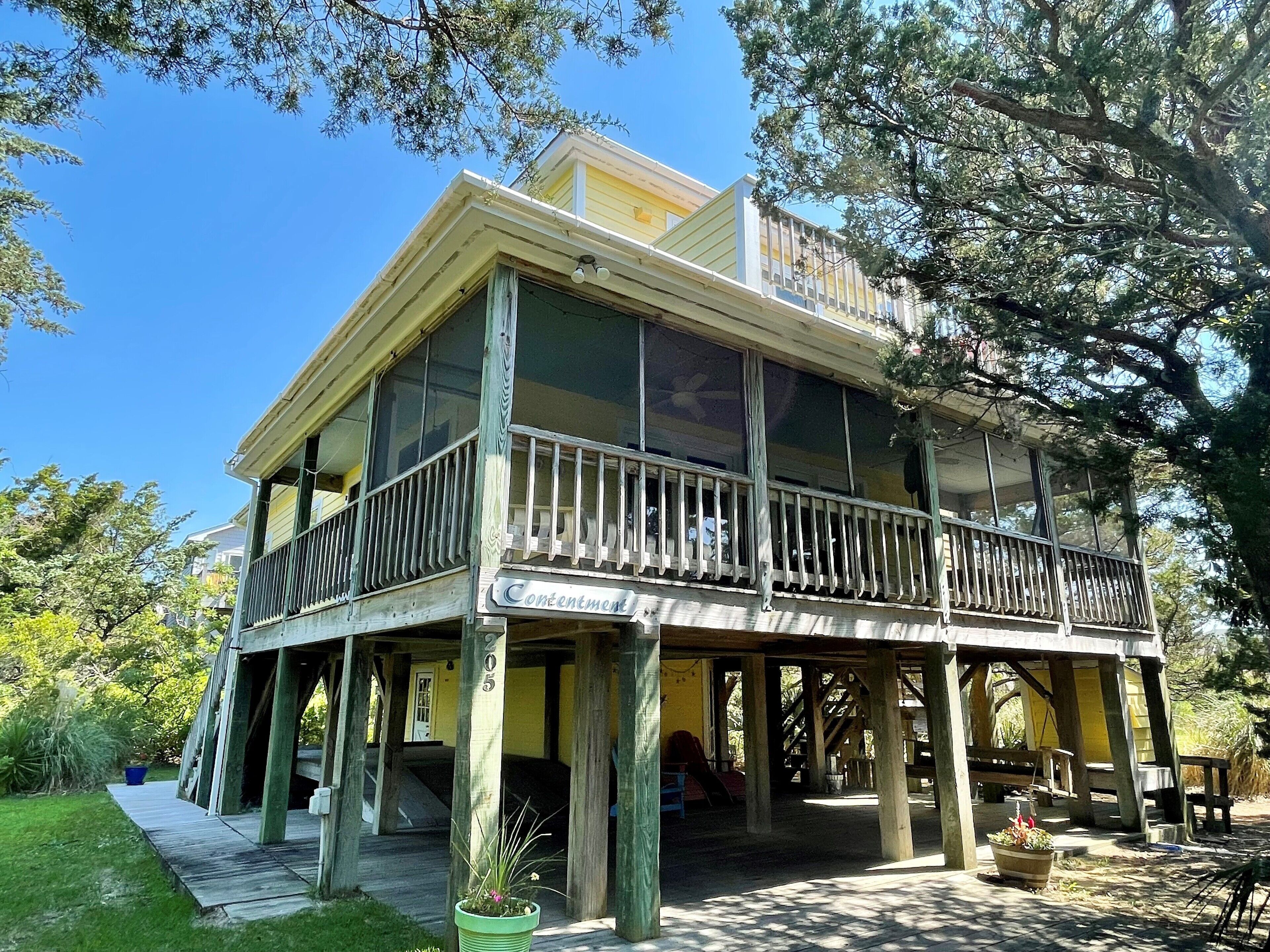 Contentment: Spacious home, den, screened porch, marsh views.