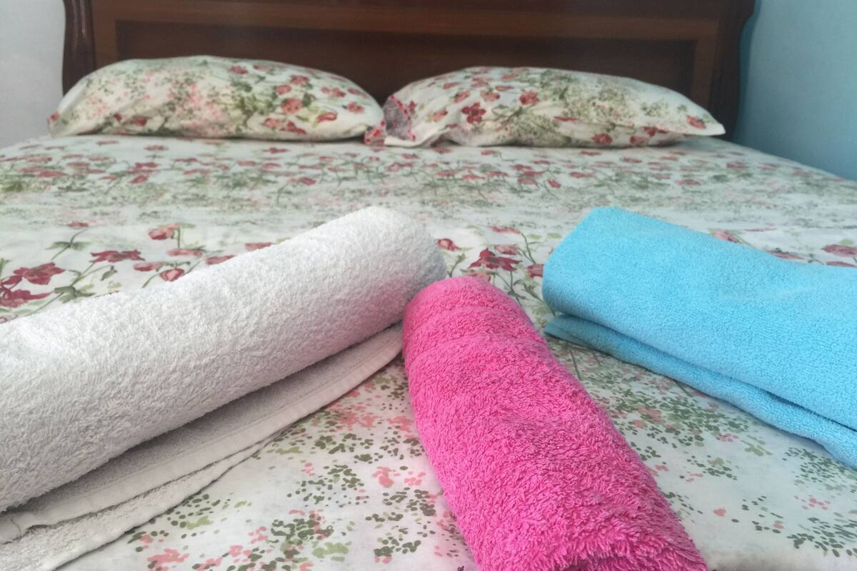 Premium bedding, desk, laptop workspace, iron/ironing board