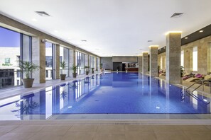 Indoor pool, open 6:30 AM to 10:30 PM, pool loungers