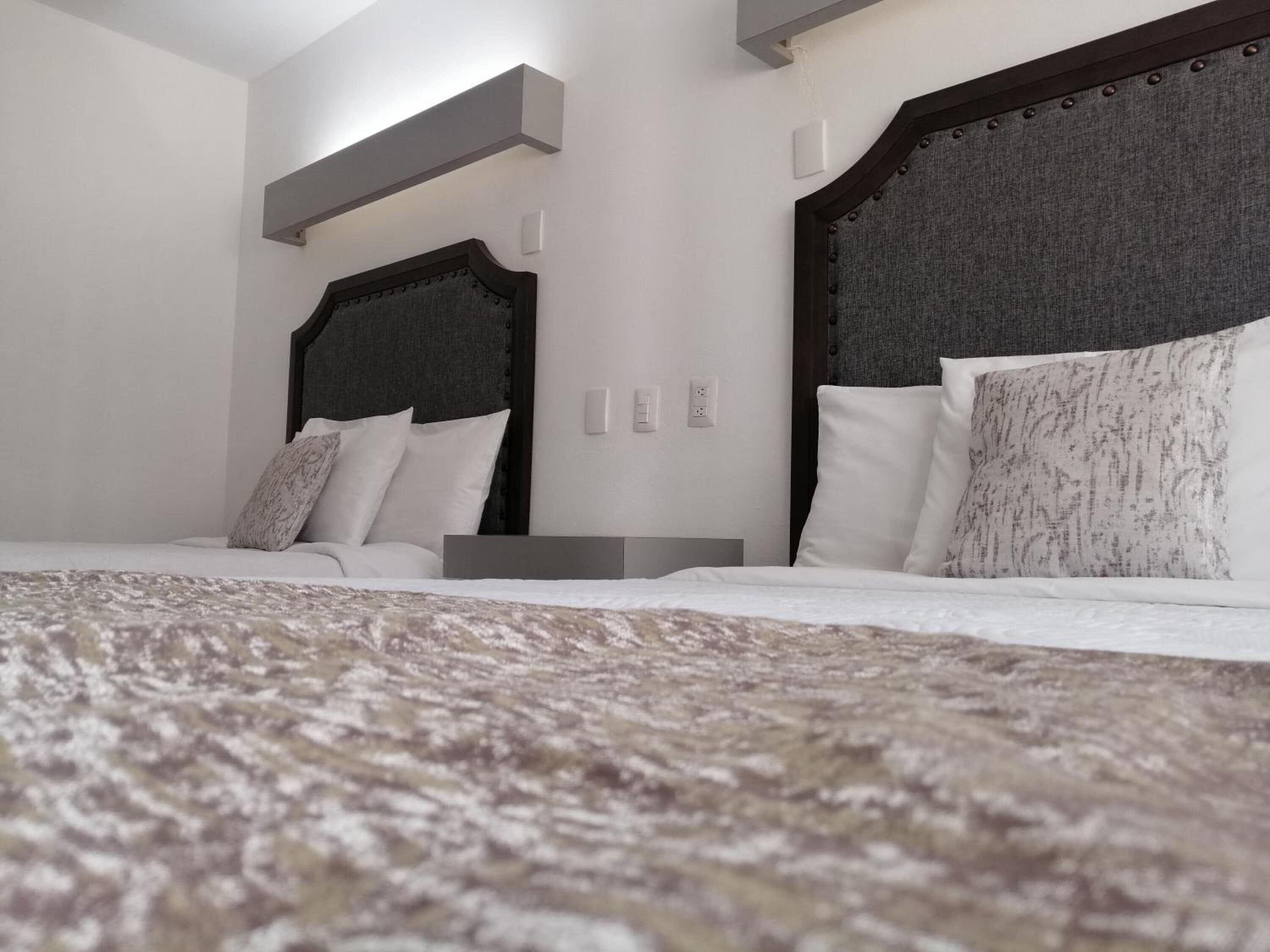 premium bedding, down duvets, pillow-top beds, individually furnished