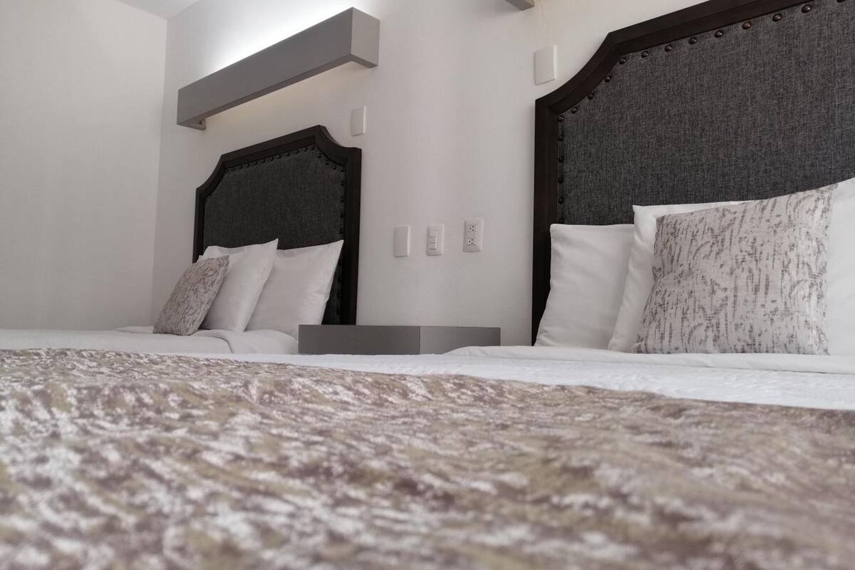 premium bedding, down duvets, pillow-top beds, individually furnished