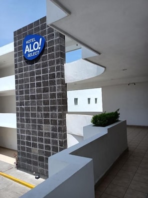 A modern hotel entrance with a prominent sign reading 'HOTEL ALO! SELECT'. - Alo Select Mazatlan (Mazatlán)