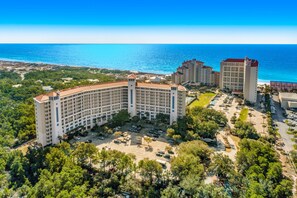 Experience the serene coastal setting of this hotel, surrounded by lush greenery and offering stunning ocean views.