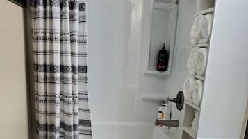 Combined shower/bathtub, hair dryer, towels, soap