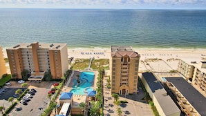 A hotel with a pool, beach access, and a view of the ocean. - Crystal Tower 1907 (Gulf Shores)
