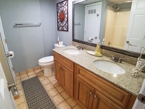 Bathtub, hair dryer, towels, soap